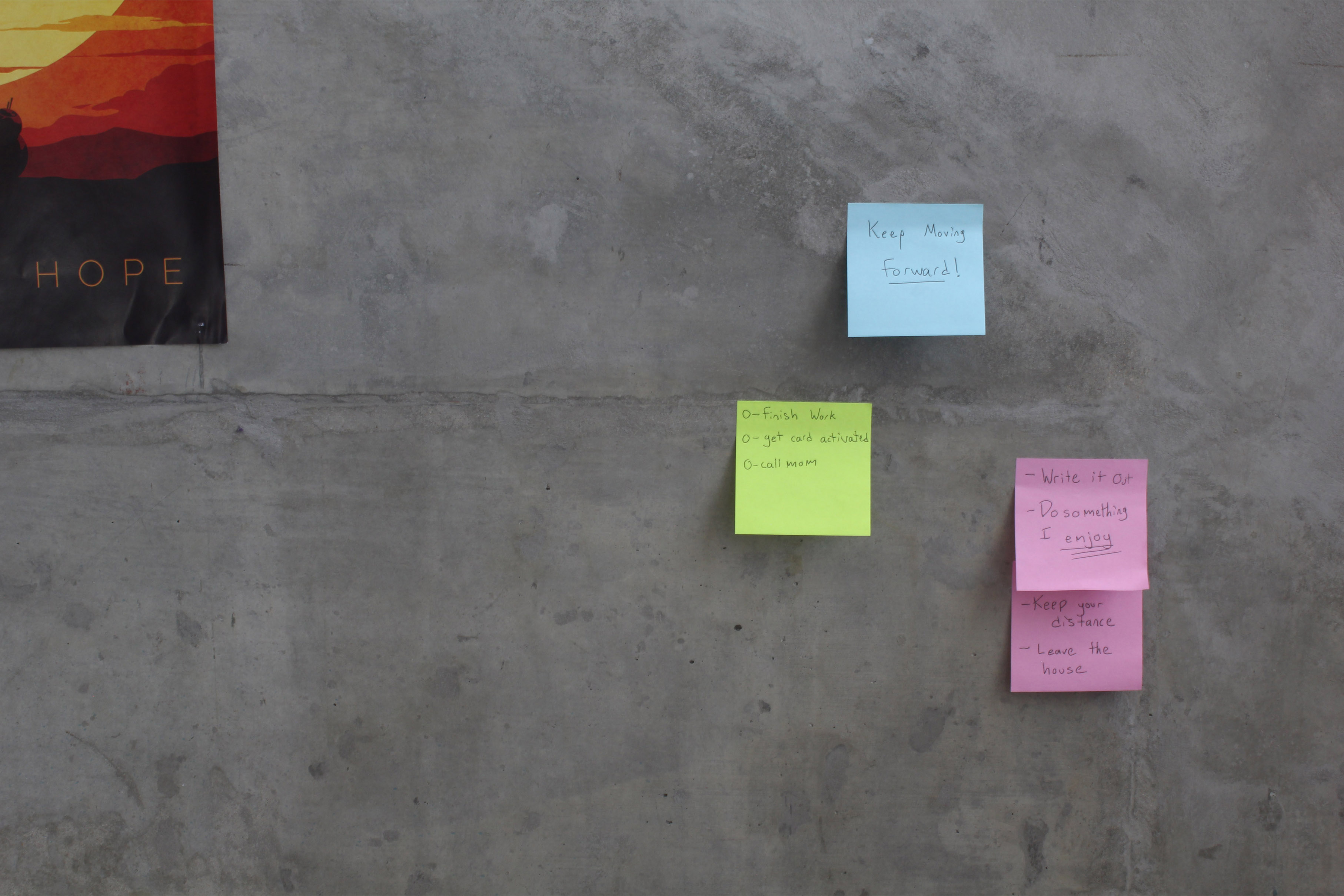 View full size version of sticky notes on a concrete wall